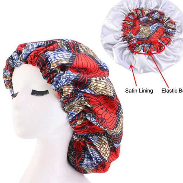 Colorful satin-lined bonnet on a mannequin head with labeled satin lining and elastic band.