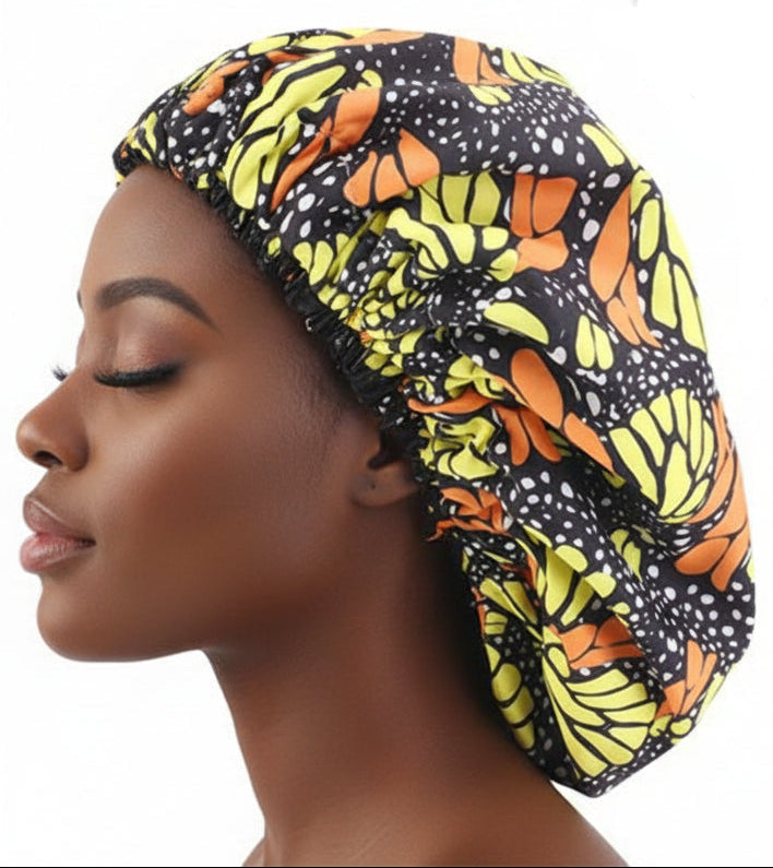 Colorful satin bonnet with butterfly pattern on a white background