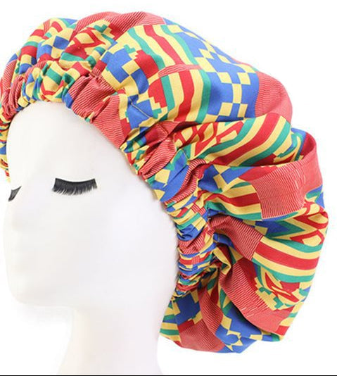 Colorful patterned headwrap on a mannequin head with a close-up of the pattern on a white background.