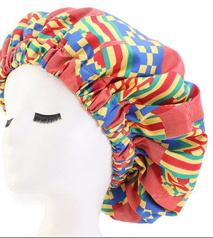 Colorful patterned headwrap on a mannequin head with a close-up of the pattern on a white background.