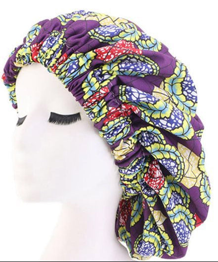 Colorful satin-lined hair bonnet with elastic band on a white background