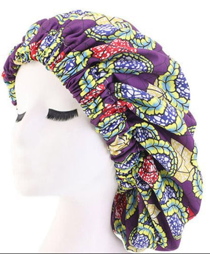 Colorful satin-lined hair bonnet with elastic band on a white background