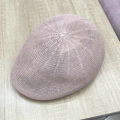 Hand-hooked Korean short brim peaked cap in beige on white background