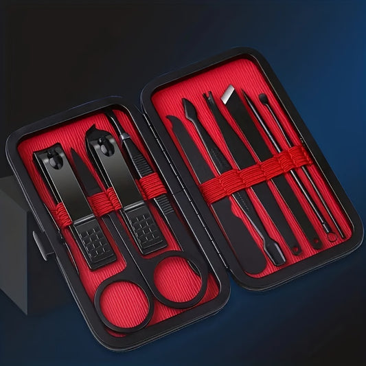 Manicure set with black tools and red accents in a black case on a dark blue background