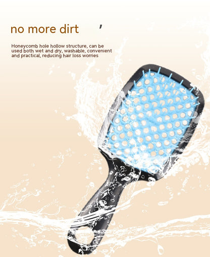 Hairbrush with blue bristle head on a beige background, text 'no more dirt' above.