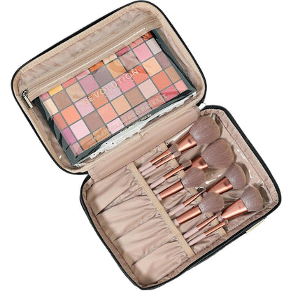 Makeup set with brushes and a palette in an open case on a white background
