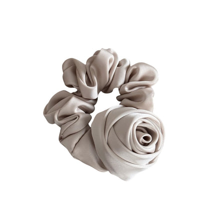 Beige scrunchie on a white background
