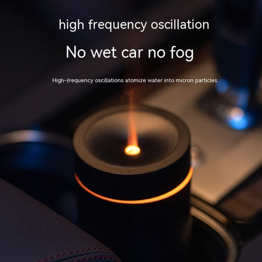 Car air freshener with flame inside, placed on a car dashboard.