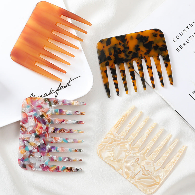 Set of four decorative hair combs on a white surface with text.