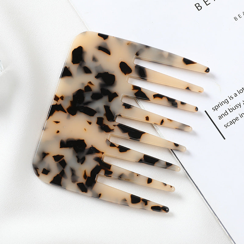 Tortoiseshell patterned comb on a white background -Marble-finish cellulose acetate hair comb, anti-static and gentle on hair