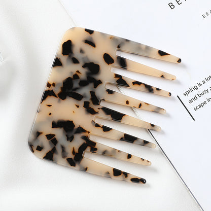 Tortoiseshell patterned comb on a white background -Marble-finish cellulose acetate hair comb, anti-static and gentle on hair